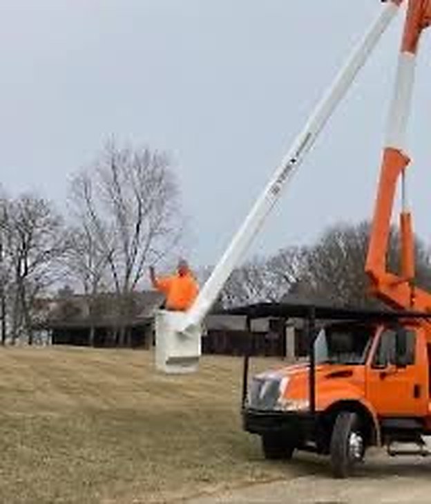 Don Kottman working from the bucket truck
